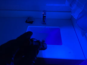 Environmental inspection under black light at hotel guest  bathroom